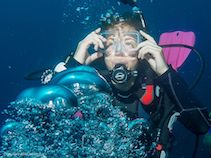 diver girl blowing bubbles