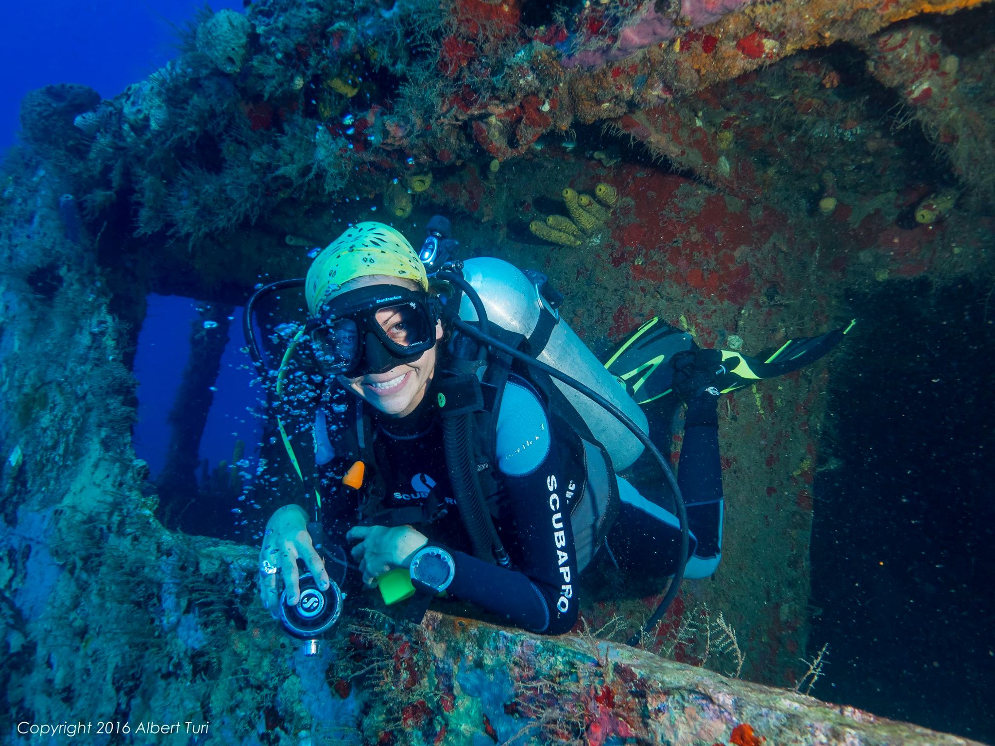 diver exploring shipwreck